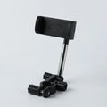 Black car dashboard mobile phone holder showing 360-degree rotation mechanism and foam padding