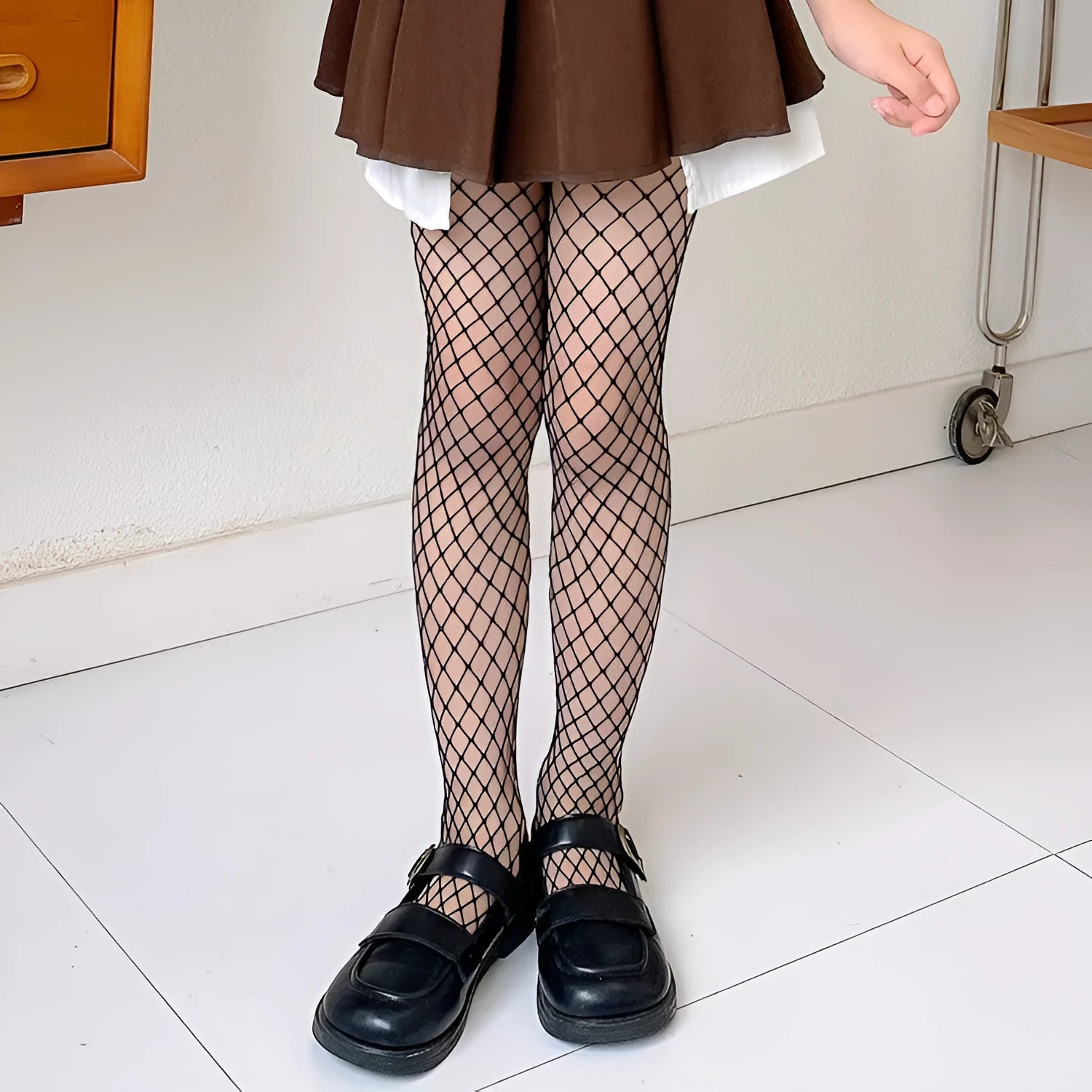 Women's black and white mesh stockings showing large, medium, and small net patterns.