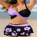 Women's purple high-waisted bikini swimsuit with skirt and lace-up back detail
