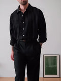 Men's black pinstriped button-down polyester shirt with long sleeves and a regular fit.