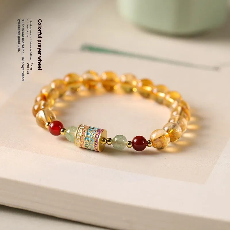 Yellow citrine prayer wheel bracelet with 8mm round beads and adjustable fastening