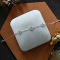 Women's S925 sterling silver bracelet with floral pattern and heart shapes in white gold or golden colour