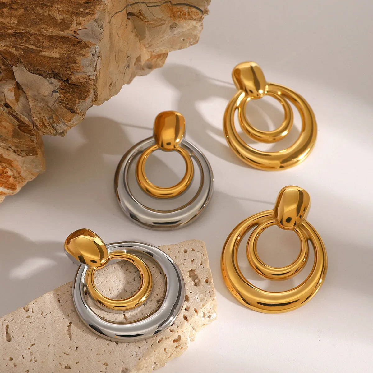 Round double layer hollow geometric stud earrings in gold tone with butterfly backs
