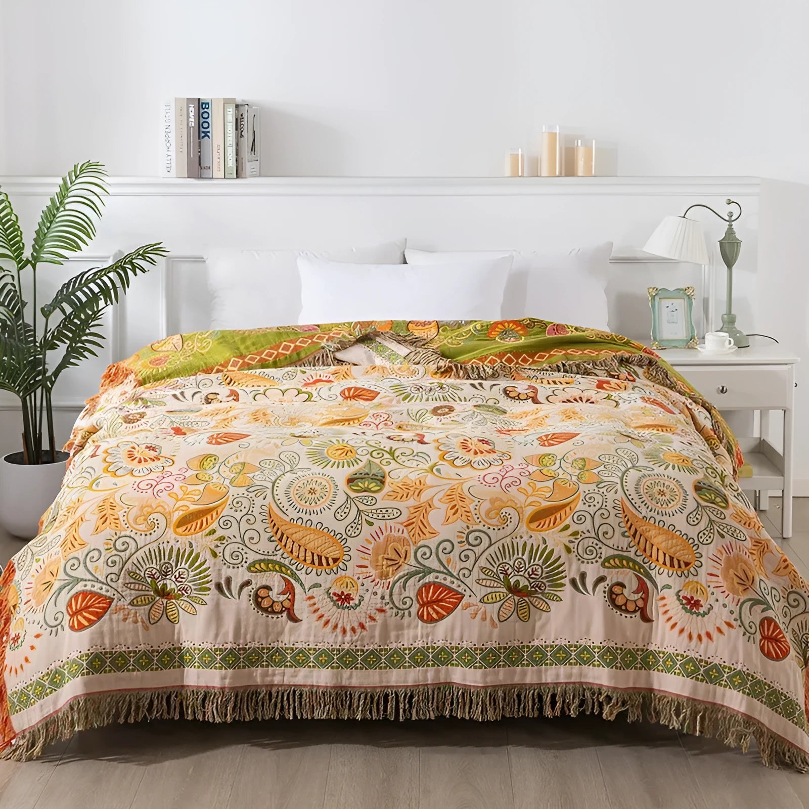 Cotton gauze towel quilt with tassels in beige flower pattern on a bed