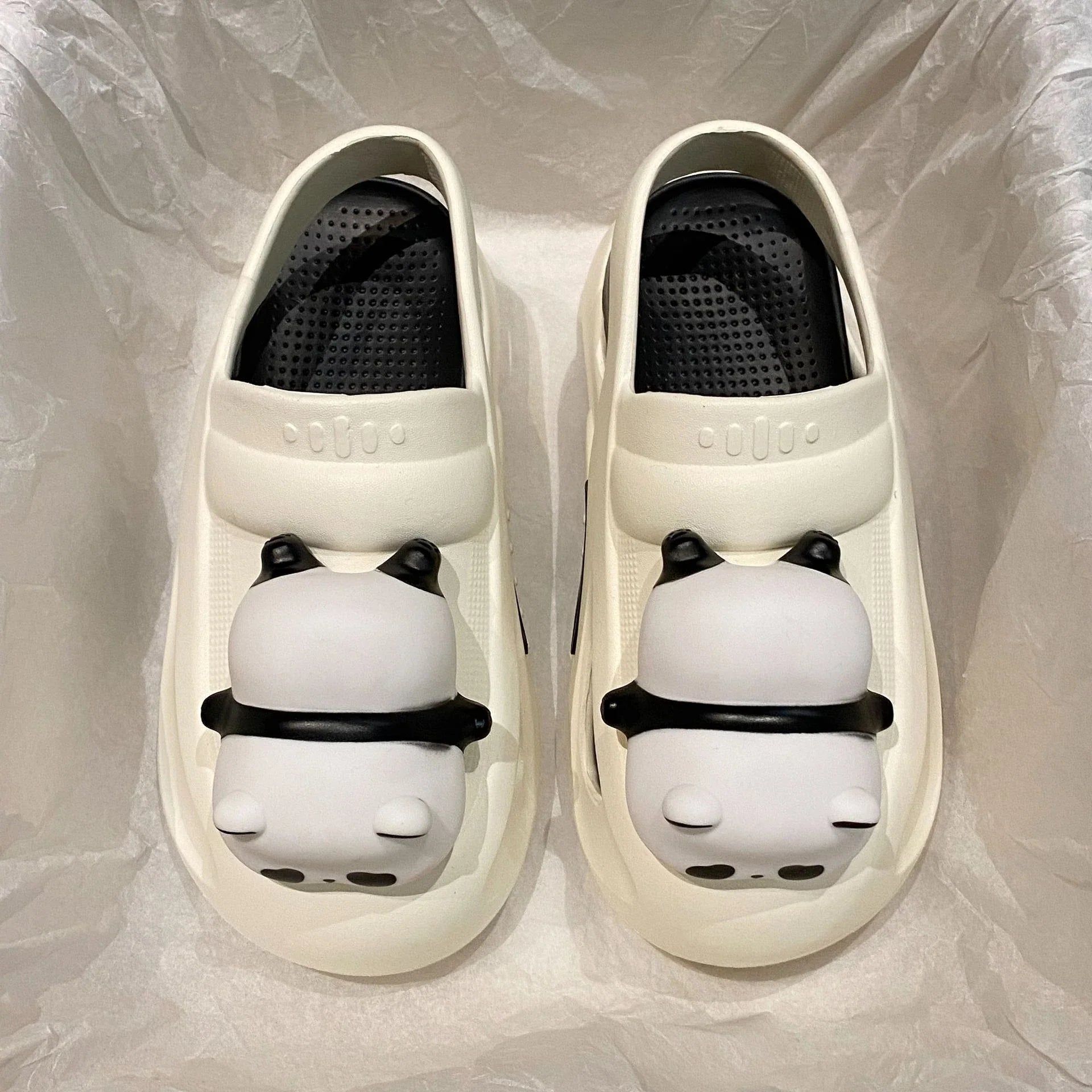 Adorable panda-themed slippers with LED lamp feature, offering cozy comfort and whimsical style for summer