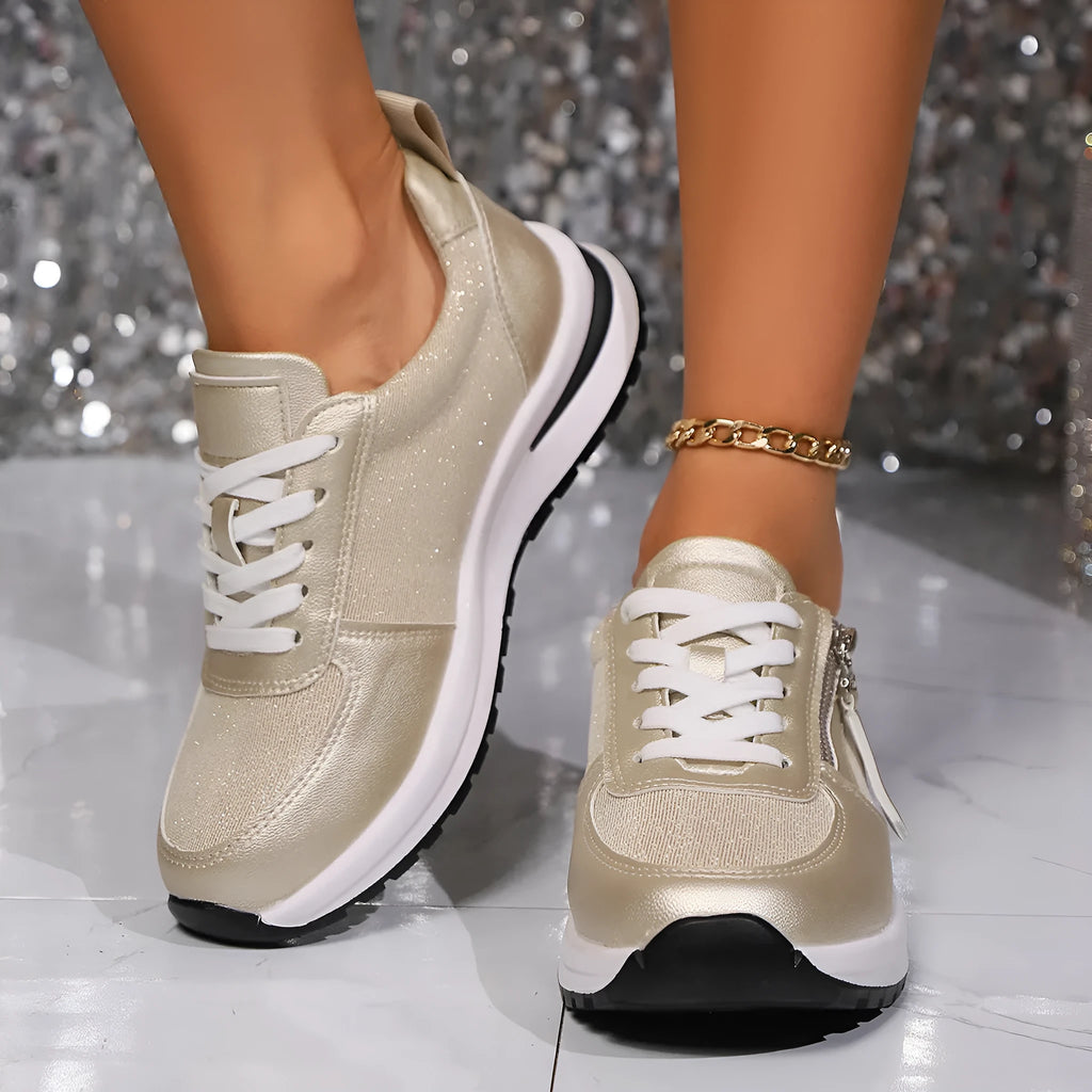 Gold women's flat lace-up pumps with round toe and shallow vamp on a rubber sole, showing European large size label.