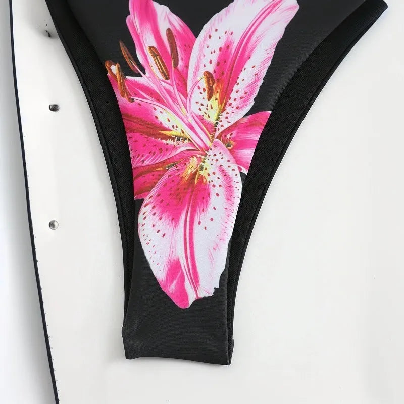 Women's printed bikini three-piece set with black red flowers and matching wrap skirt in polyester