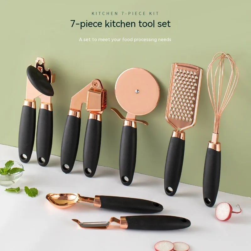 Seven-piece stainless steel kitchen tool set with copper plating on a matching storage rack.
