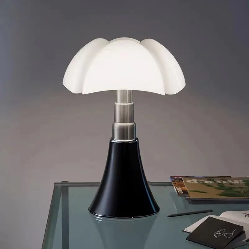 Italian retro flower design table lamp in a choice of colours on a bedside table.