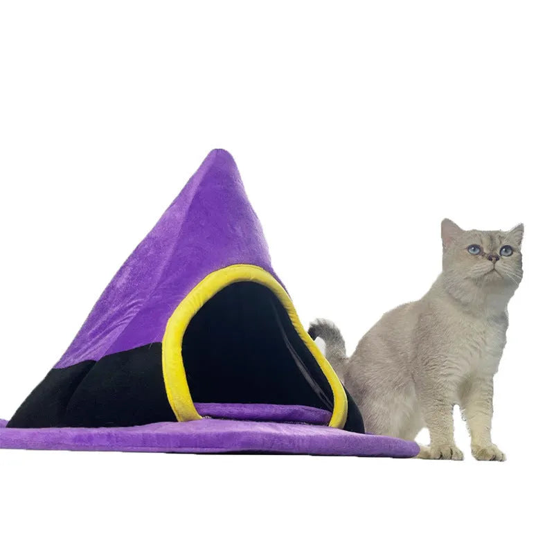 Purple cloth witch hat shaped cat bed for Halloween.