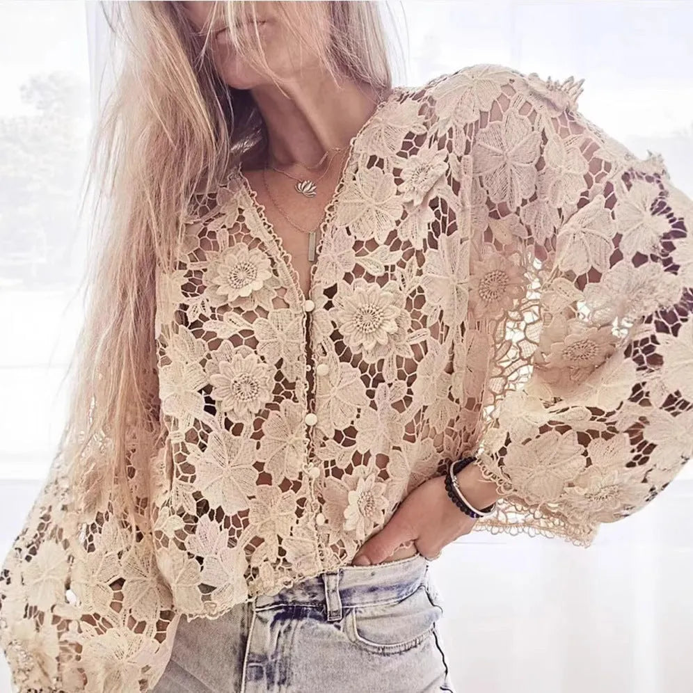 Loose fit black lace cardigan with V-neck, hollow long sleeves, and raised three-dimensional floral lace decoration.