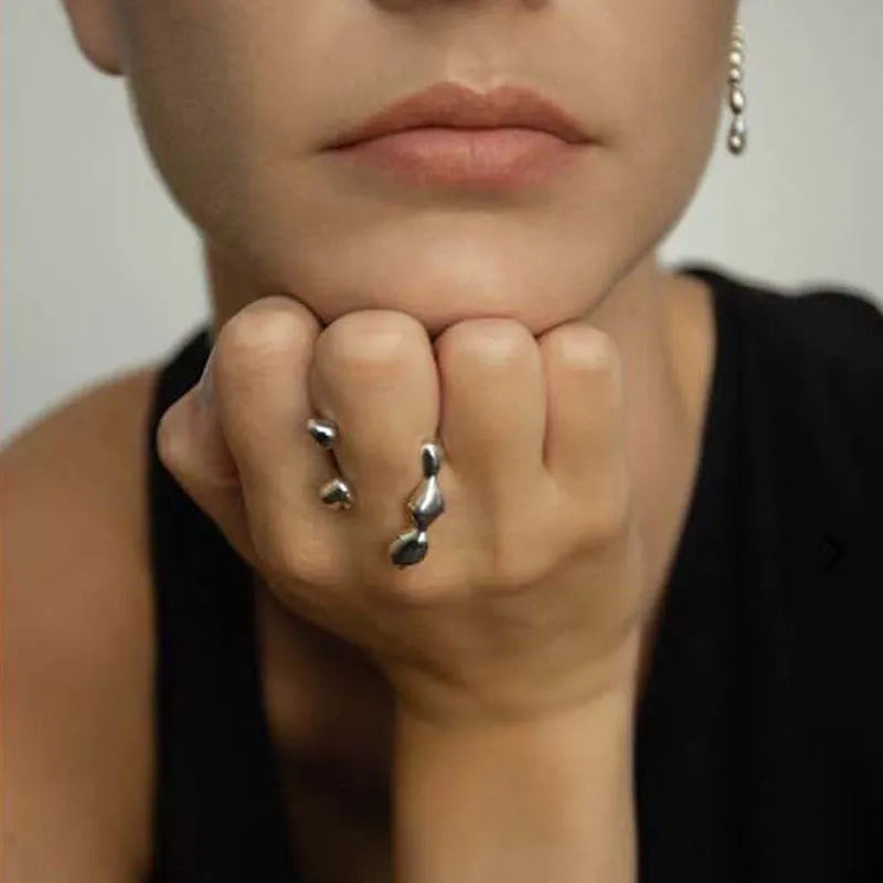 Brass opening ring for women with spherical design in gold or silver finish.