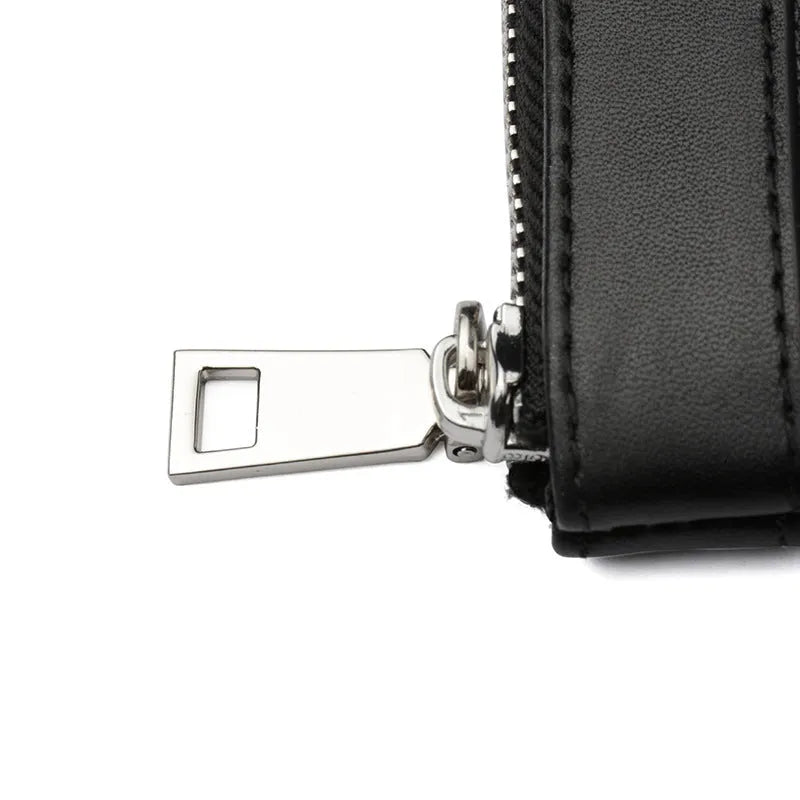 Black genuine cowhide leather men's clutch wallet, shown closed, measuring 20 by 10 centimetres.