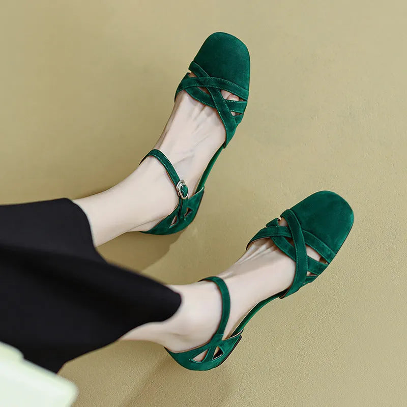 Apricot coloured classic Roman sandals with a buckle fastening and round toe on a rubber sole.