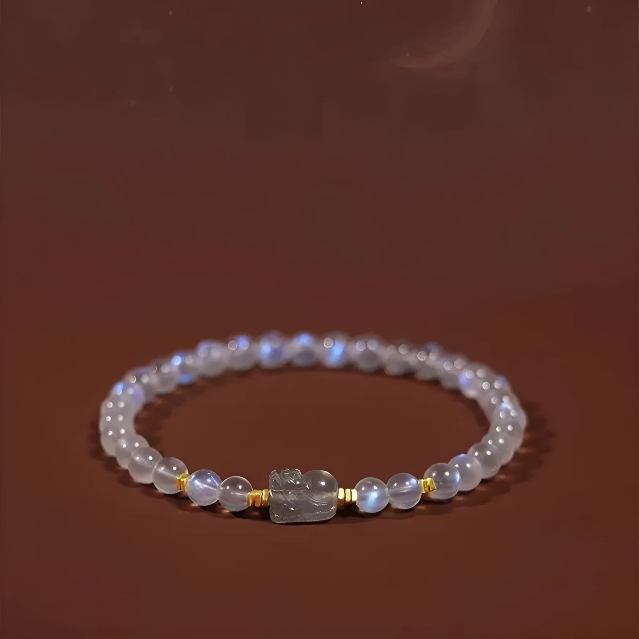 Moonstone women's bracelet with hand-ground beads and animal zodiac charms in fashion blue light colour