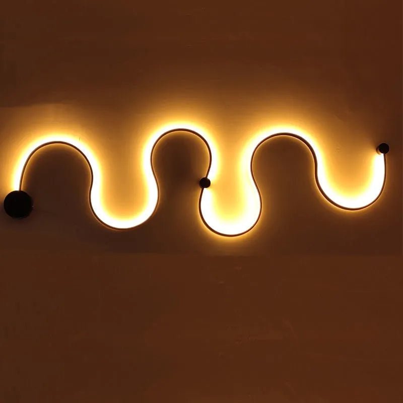 Black and white aluminium shade LED wall lamp in small, medium, large, and plus sizes