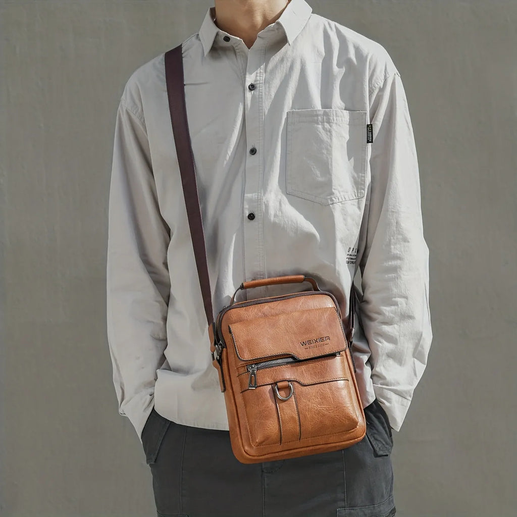 Brown men's PU leather crossbody shoulder bag with adjustable strap, top handle, multiple pockets, and card holder wallet.