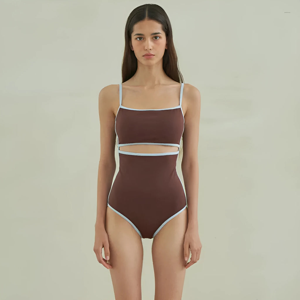 Brown triangle one-piece swimsuit for women on a mannequin, showing front design.