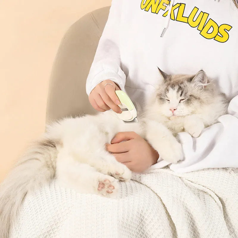 Blue dual-use pet grooming comb with cleaning needle floating mechanism for dog and cat hair removal.