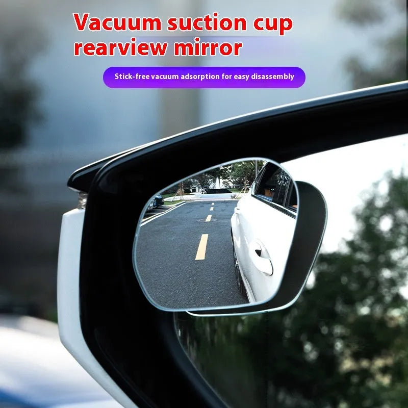 Pair of 360-degree wide-angle suction cup car mirrors in black, white, and silver on a car windscreen