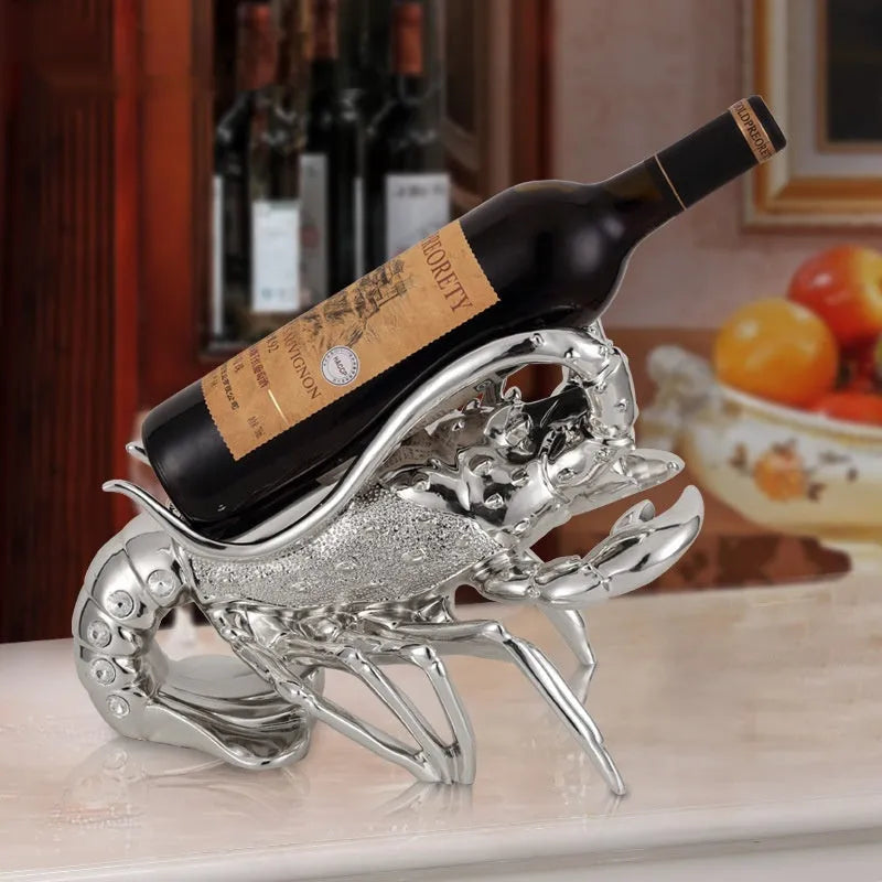Lobster-shaped resin wine rack in silver or rose gold holding two bottles