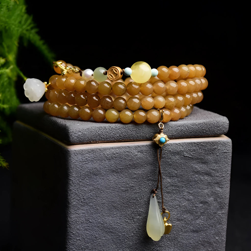 Women's natural bracelet with green pine beads, jade leaves, and beeswax accents