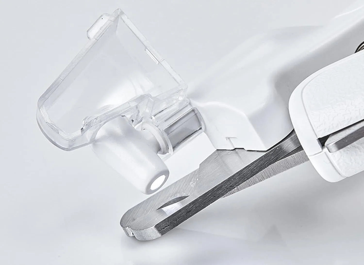 White LED pet nail clippers with a transparent anti-splash guard and an integrated nail file on a grey background.
