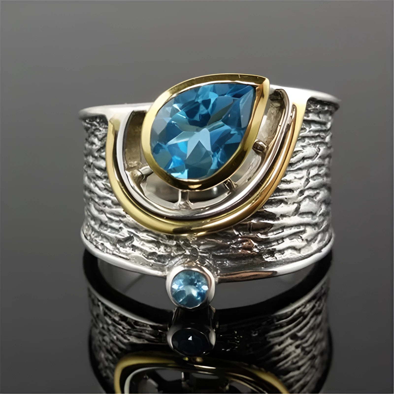 Blue rhinestone zircon ring with a Chinese style drop shape on an alloy band.