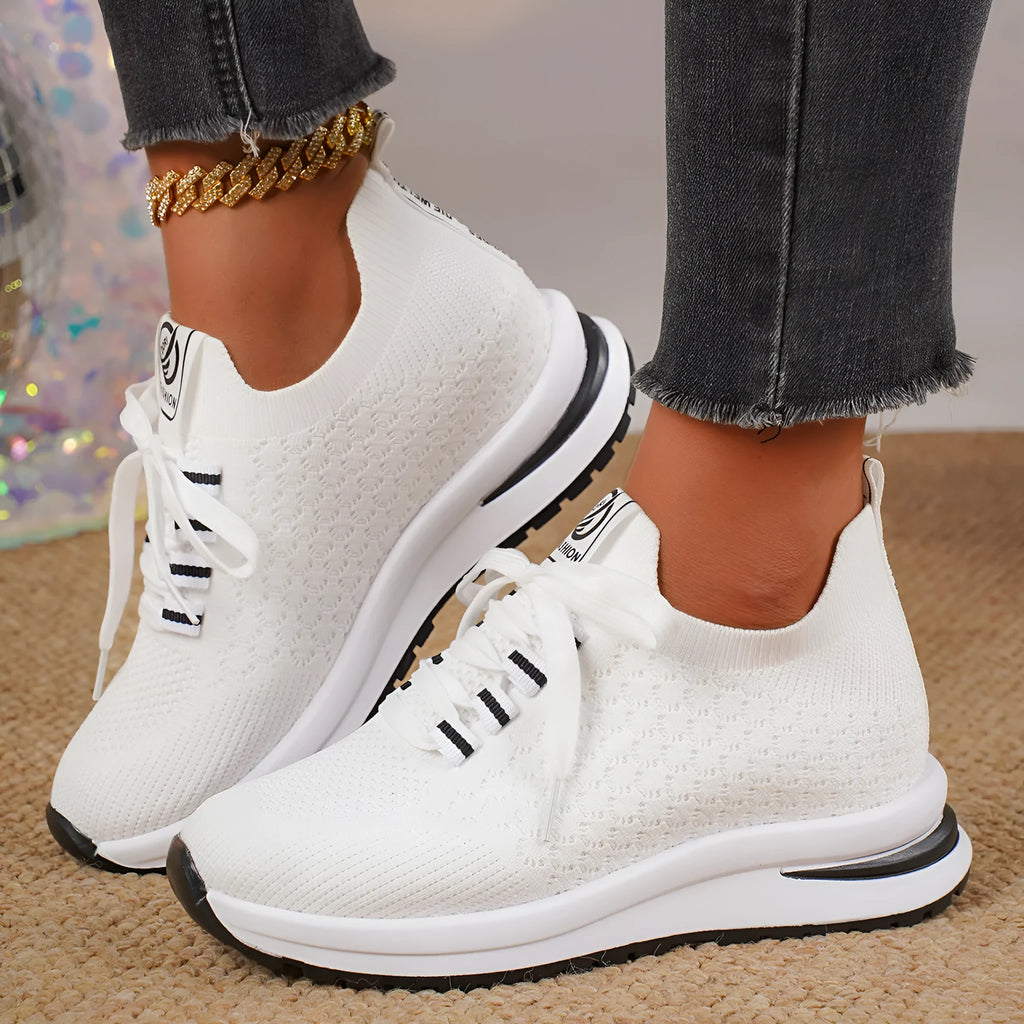 Women's black and white mesh platform sneakers with lace-up front and rubber sole