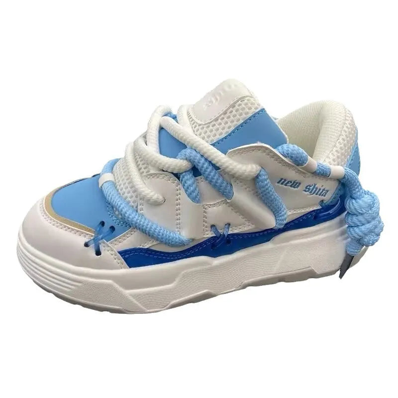Women's grey clunky sneakers with thick rubber sole and round toe, shown with blue and black colour options.