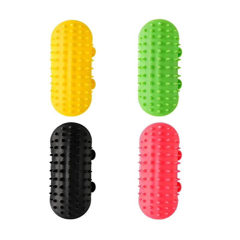 Silicone cat grooming comb with adjustable strap mounted on a table leg.