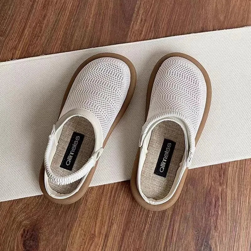 Beige linen slip-on shoes with mesh lining and a light rubber sole on a neutral background.