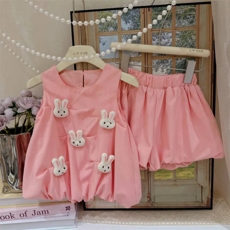 Cotton two-piece suit with long-sleeve shirt and pants, bud-shaped doll detail, pink or yellow, sizes 80-130 yards.