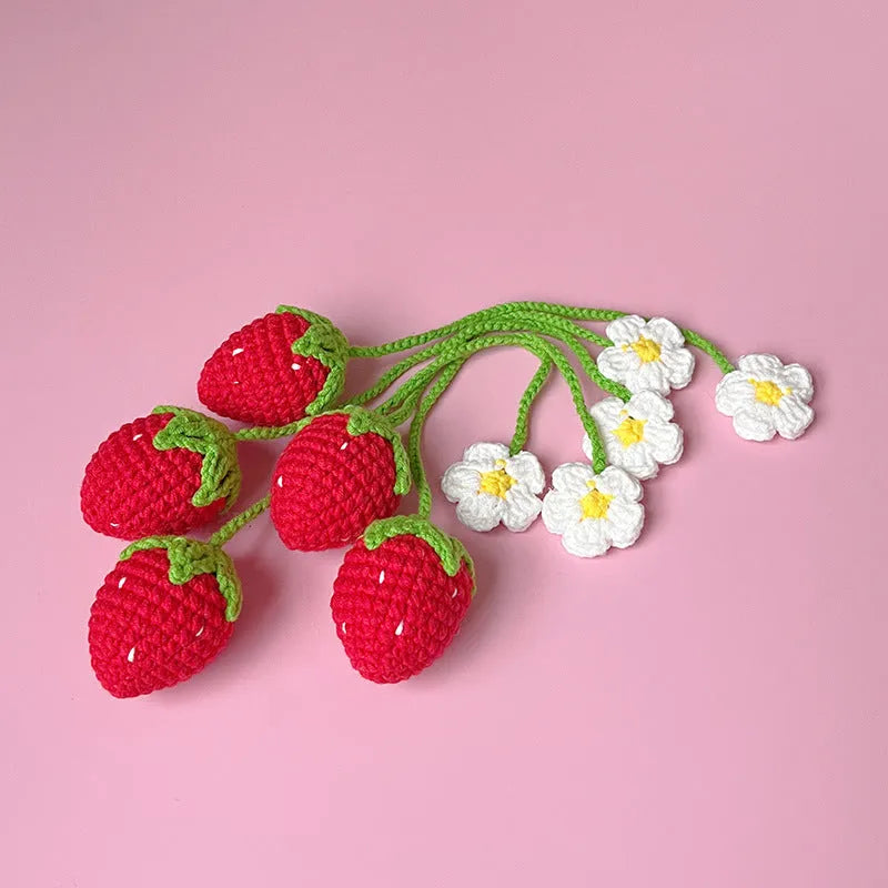 Wool crochet strawberry pendant necklace in pink colour with textured knitting details