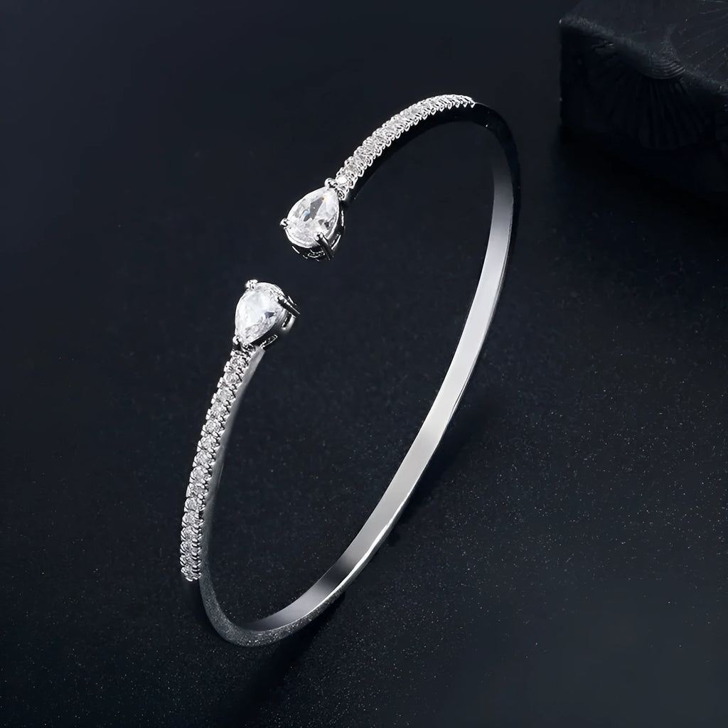 Personalised copper bracelet with multi-zircon inlay, shown in white and blue colour options