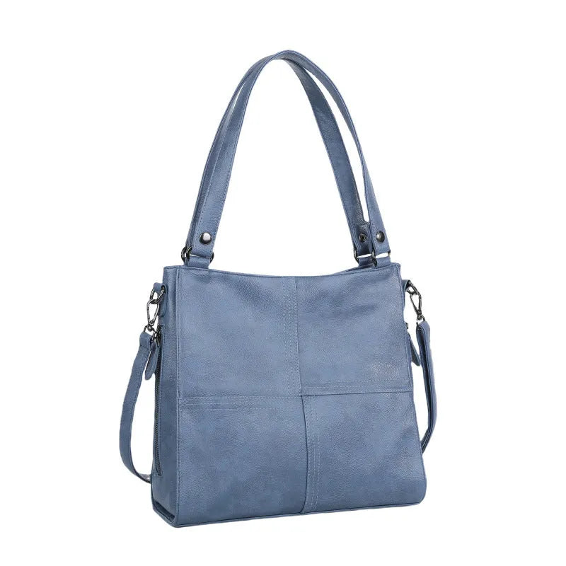 Soft PU retro style crossbody handbag in barrel shape showing pocket sandwich design.
