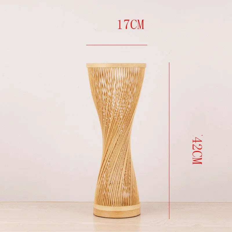 Hand-woven bamboo bedside lamp with natural finish, 40cm height, on wooden bedside table