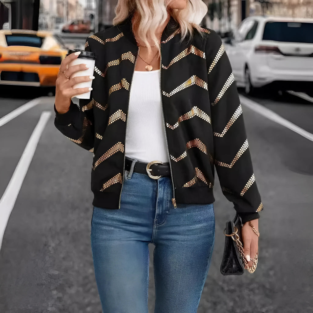 Women's black polyester spring jacket with gold zigzag print, conventional sleeves, shown on model
