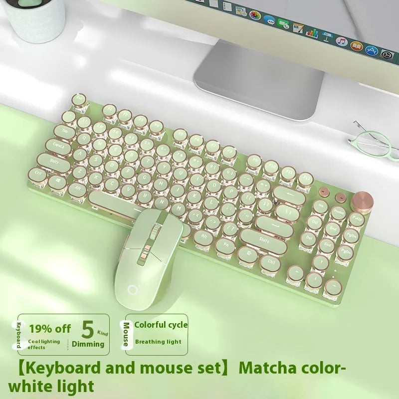 Matcha green 87-key mechanical gaming keyboard with aluminium frame and white backlighting on a desk.