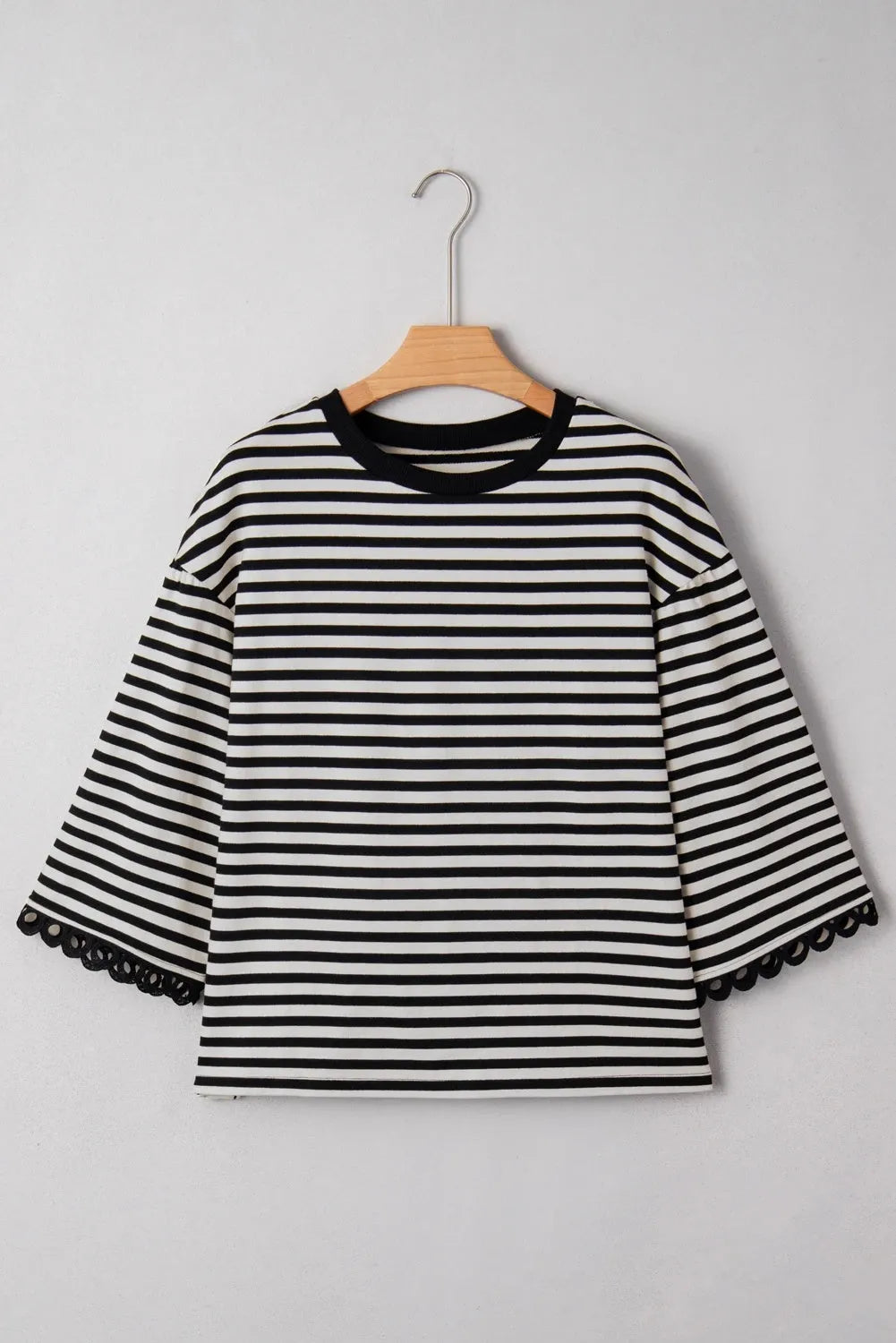 Women's striped crew neck long sleeve top in black loose fit polyester front view