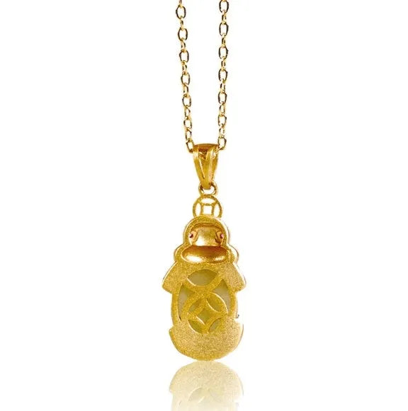 Cartoon character Hetian white jade antique gold pendant necklace with emerald pixiu charm on a chain.