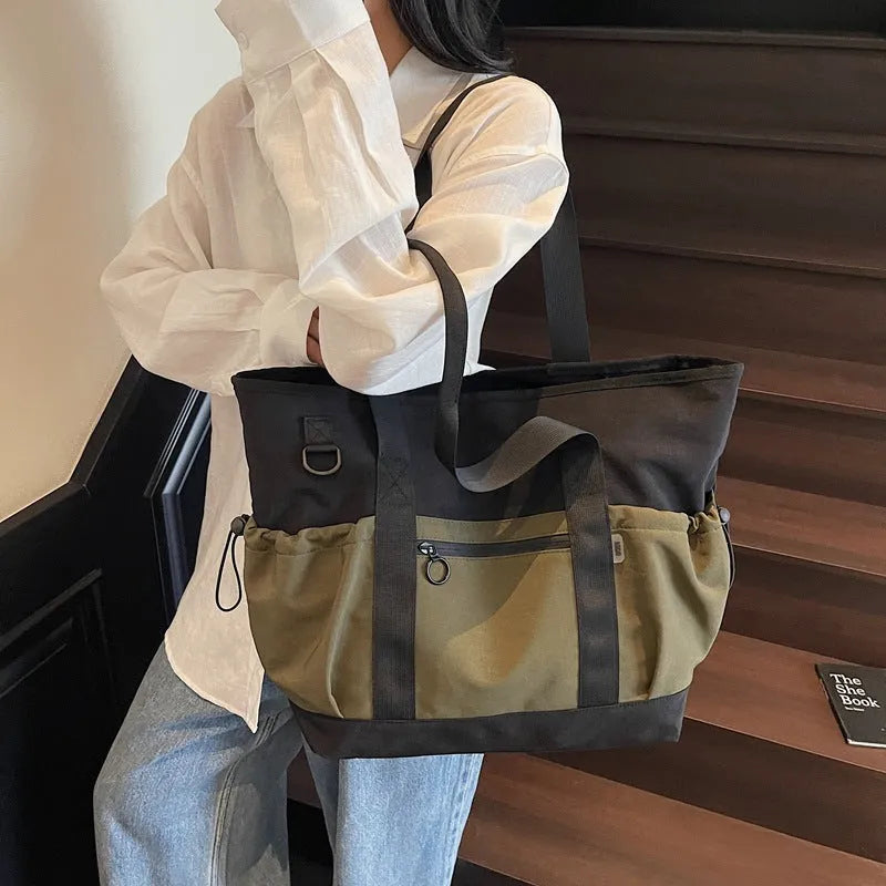 Women's lightweight Oxford cloth travel bag for yoga and fitness in grey colour with letter pattern.