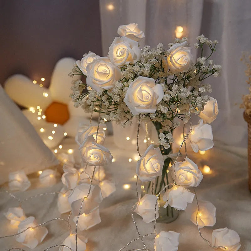LED rose fairy light string with battery pack for indoor holiday decoration.
