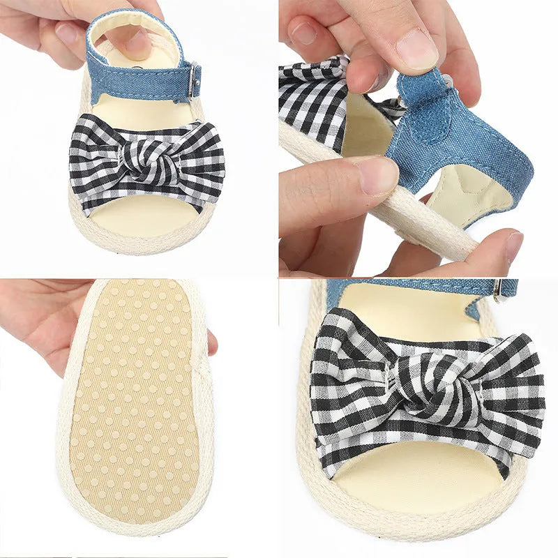 White and black toddler shoes with Velcro fastening and low tube design for babies 0-18 months