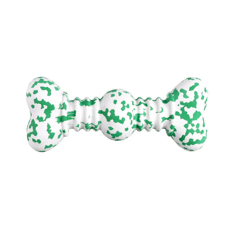 Green, white, and yellow camouflaged natural rubber bone chew toy for large dogs on a wooden surface.