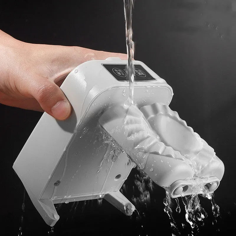 White automatic electric dumpling maker machine with USB cable and accessories on a kitchen counter.