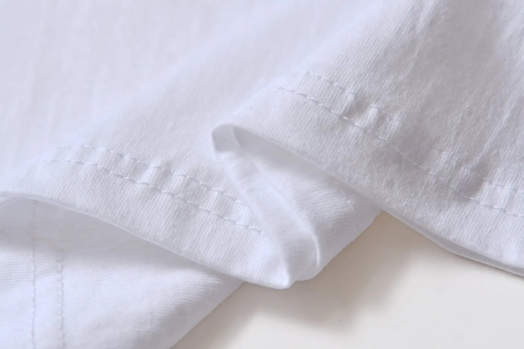 White cotton overalls with pattern design, short sleeves and round neckline for teenage summer wear