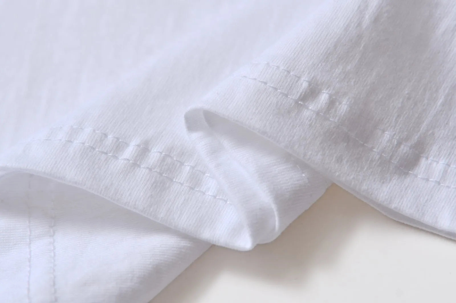 White cotton overalls with pattern design, short sleeves and round neckline for teenage summer wear