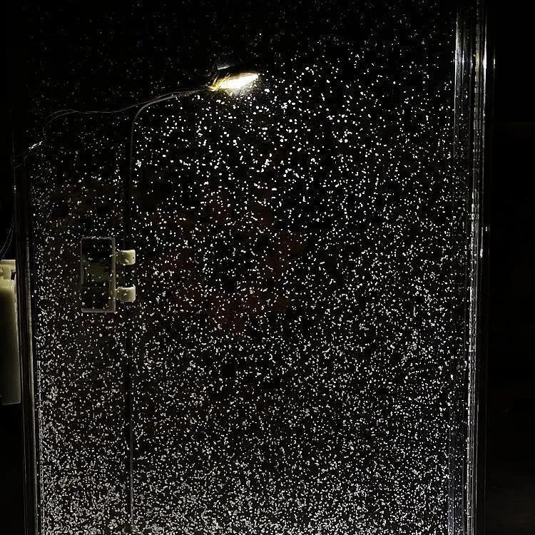 DIY material kit for building a snowy landscape night light with flowing snow effect and warm LED lights.