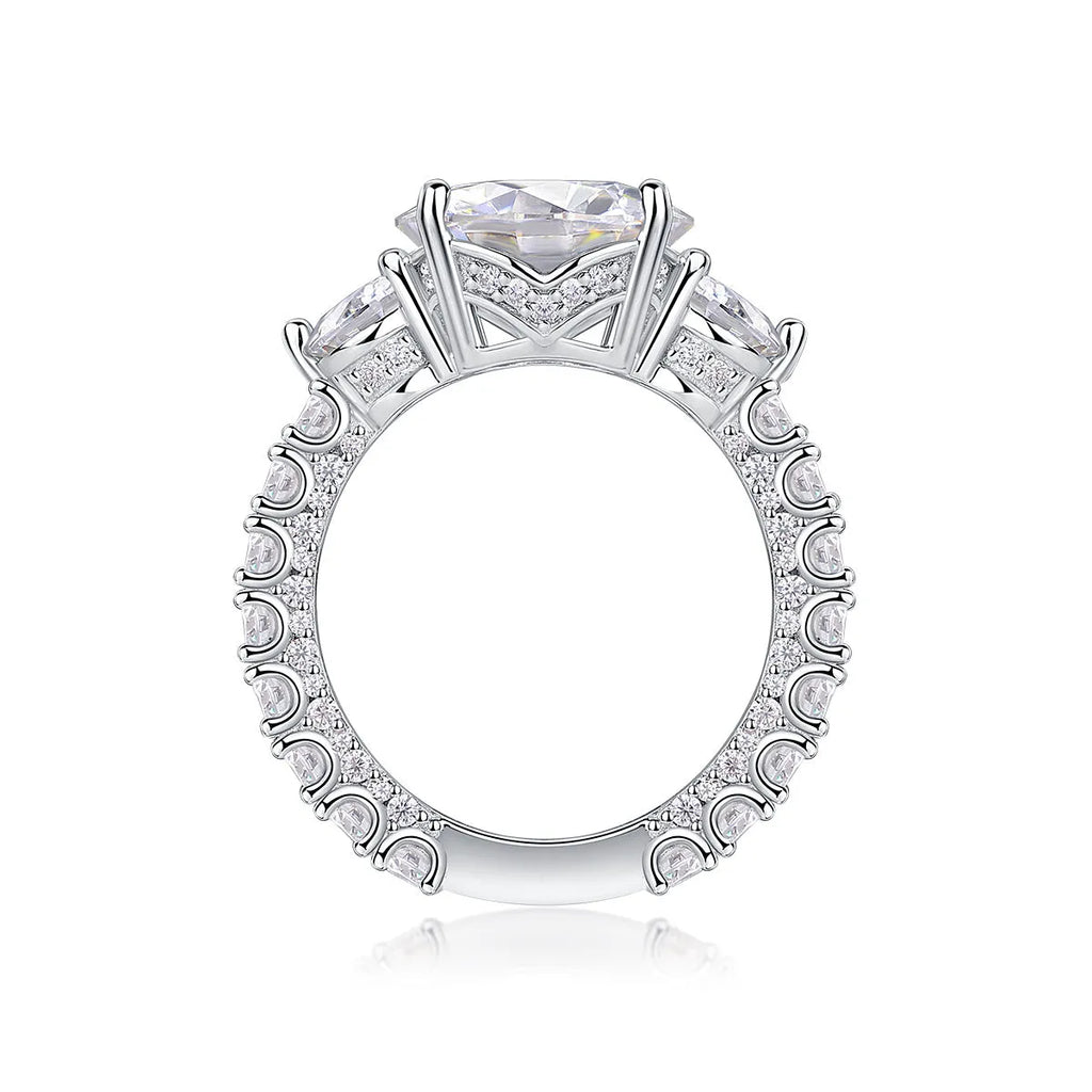 Three-diamond moissanite wedding ring with 5-carat stone, S925 silver band, platinum plating, on a white background